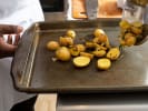 Cooking Class - A Brunch Worth Sharing in Boulder: Golden potato pieces roasting on a baking tray until crisp