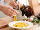 Cooking Class - Top-Tier Trattoria - Date Night in Northern Suburbs: Grating parmesan on fresh fettuccine