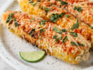 Cooking Class - Mexican Rendezvous - Date Night in Northern Virginia: Grilled elote corn garnished with cheese, herbs, and lime wedges