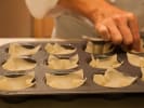Cooking Class - Satisfying Chinese-Style Comfort Food in Boulder: Hands pressing wonton wrappers into a muffin tin to form baked wonton cups
