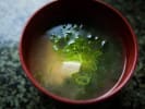 Couples Sushi Making Class - Fundamentals of Making Sushi Rolls for 2 in Downtown Seattle: Miso soup in red bowl