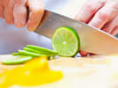 Online Mixology Class - Elevated Winter Cocktails: Mixologist slicing lime wheels