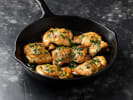 Cooking Class - Sunday Dinner on the French Riviera in Northern Virginia: pan-roasted chicken thighs garnished with herbs in cast iron skillet