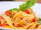 Cooking Class - Make Pasta at a Local Distillery in Downtown Chicago: Pappardelle pasta elegantly plated with basil garnish in tomato sauce