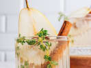 Cooking Class - Elegant Winter Feast in Houston: Pear vanilla sparkler garnished with fresh pear and herbs