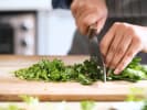 Cooking Class - Dairy and Gluten-Free French Bistro in Boston Proper: Person chopping fresh greens (1)