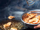 Cooking Class - Dinner With 'The Bear' in Tampa: Person making prawns in a champagne sauce
