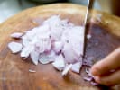 Cooking Class - Date Night: Bourbon Steak Techniques in Northern Virginia: Photo 2   person slicing shallots