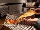 Food Tour - Original Las Vegas Strip Foodie Tour in Las Vegas: Picking up a pizza slice