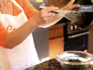 Team Building Cooking Class - Healthy Team Building in San Francisco: Pouring soup and herbs