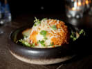 Private Chef - Michelin-Inspired Italian Surf and Turf: Prosciutto Arancini plated with micro greens