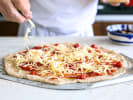 Cooking Class - Pizzaiolo for a Day in Edmonton: Putting cheesy toppings