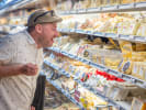 Private Food Tour - Hometown Eats in Milwaukee: person exploring local cheese selection