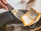 Cooking Class - Printemps Feast of Flavor in Manhattan: Salmon fillet being cooked in a pan