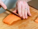 Cooking Class - Printemps Feast of Flavor in Manhattan: Salmon fillet being sliced on a cutting board