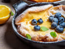 Cooking Class - Elegant East Coast Brunch in Northern Virginia: Skillet Soufflé Pancake with lemon on the side and blueberries on top