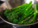 Cooking Class - Elegant Coastal Surf & Turf - Date Night: Steamed broccolini in a stainless steel pot, vibrant green and freshly cooked