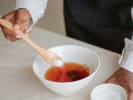 Cooking Class - Homemade Kombucha Brewing for Beginners in Minneapolis: Stirring tea in a bowl