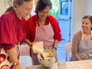 Cooking Class - Master French Macarons Step by Step in Culver City: Three participants mixing macaron batter together during a group baking class