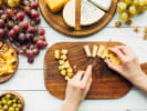 Team Building Cooking Class - Charcuterie Board-Making Contest: slicing cheese for a charcuterie board