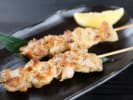 Cooking Class - Creative Japanese Bento Box - Family Fun in South Bay & Peninsula: Yakitori chicken skewer on a black plate with citrus on the side