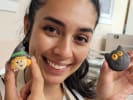 Team Building Cooking Class - Create Character Macarons With Your Team: a girl holding her cute character