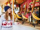 Food Tour - Festive Flavors of NYC’s Holiday Markets: a lady looking at raclette cheese during food tour