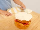 Cooking Class - Foodies Baking: Kids’ Edition in South Bay & Peninsula: layering fresh berry cake with vanilla frosting