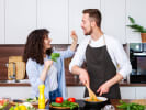 Cooking Class - Classic Italian Table - Date Night in Downtown Dallas: a couple having fun in the kitchen cooking together