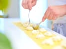 Cooking Class - Make Lemon Ricotta Ravioli at a Local Brewery in Baltimore: adding Parmesan cheese and ricotta filling to the pasta sheet