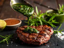 Cooking Class - Vibrant American Menu: adding chimichurri sauce over steak