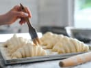 Cooking Class - Hands-On French Croissant Workshop in Naperville: brushing croissants before baking
