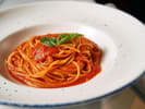 Team Building Cooking Class - Italian Mystery Ingredient Pasta Showdown in Austin: capellini tomato pasta in a plate