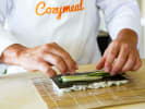 Sushi Making Class - Sushi Adventures: chef adding cucumber to sushi roll