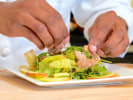 Cooking Class - Essential French Cooking 101: chef assembling a salad with candied pecans