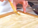Cooking Class - Vegan Pastry Workshop: chef brushing brown butter on phyllo sheets