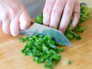 Team Building Cooking Class - Mediterranean Cooking Techniques in Nashville: chef chopping fresh parsley