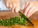 Cooking Class - Middle Eastern Classics: chef chopping fresh parsley