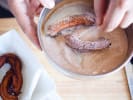 Cooking Class - Traditional Tapas and Paella: chef coating churros in sugar and cinnamon