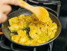Cooking Class - Celebration of Global Eats in Queens: chef cooking chicken tikka masala