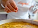 Team Building Cooking Class - Cooking and Conversation Over Spanish Fare in San Francisco: chef cooking homemade paella