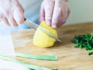 Online Cooking Class - Chettinad Chicken Curry and Lemon Rice: chef cutting a lemon