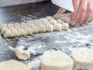 Cooking Class - A Tour of Northern Italy in Denver: chef cutting gnocchi
