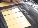 Cooking Class - Handcrafted Pasta From Scratch in DC: chef cutting pasta sheets