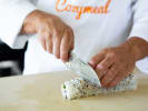 Cooking Class - Learn to Make Fresh Sushi Rolls in Downtown Chicago: chef cutting sushi roll