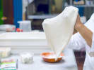 Team Building Cooking Class - Gourmet Pizza-Making Workshop in Indianapolis: chef handling fresh pizza dough 2