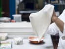 Cooking Class - Gourmet Pizza-Making Essentials: chef handling fresh pizza dough