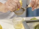 Cooking Class - Bounty of the Sea: chef juicing a  lemon by hand
