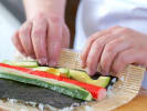 Team Building Cooking Class - Handmade Sushi Rolls: chef making a california roll