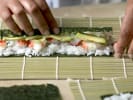 Cooking Class - Authentic Tempura and Sushi: chef making a sushi roll with rice crab and avocado